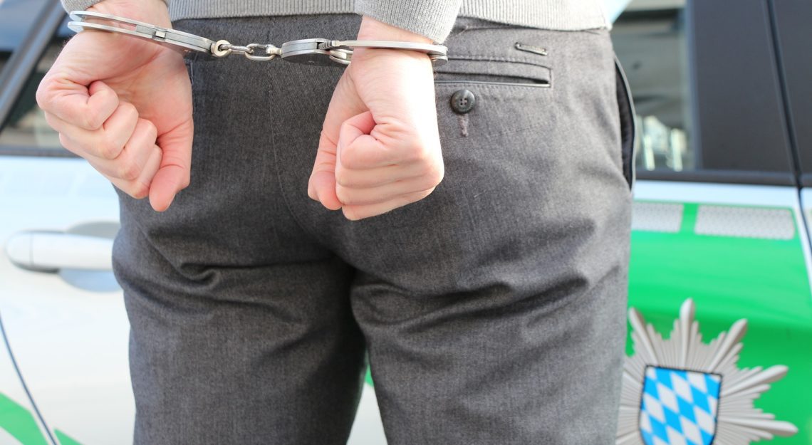 Man with hands in handcuffs
