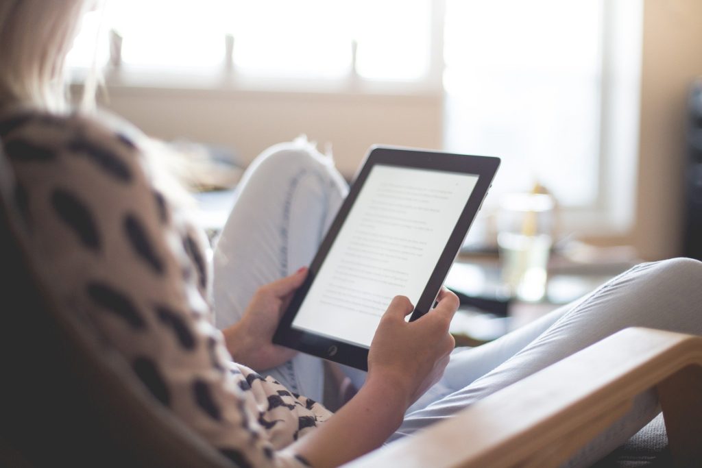 A person reading on an e-reader