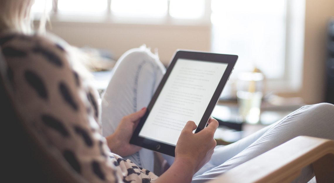 A person reading on an e-reader