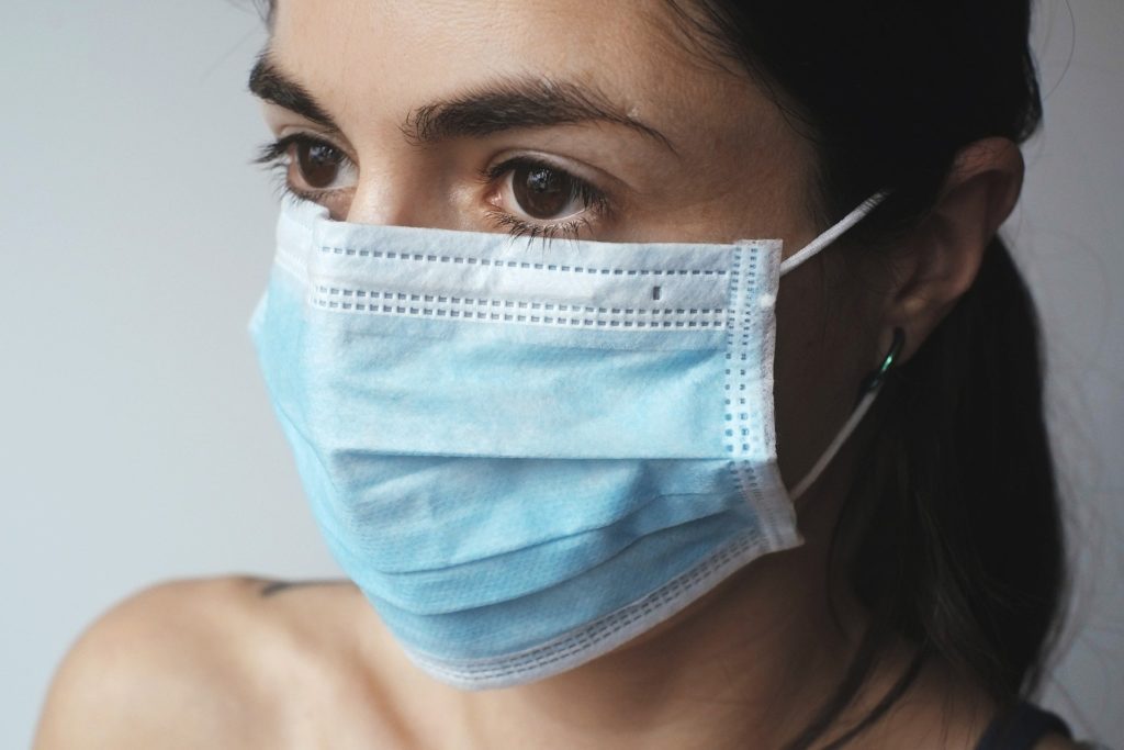 A woman in a surgical mask