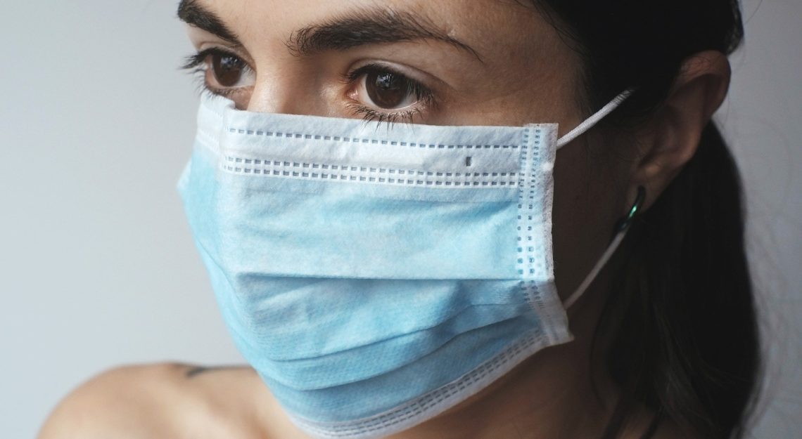 A woman in a surgical mask