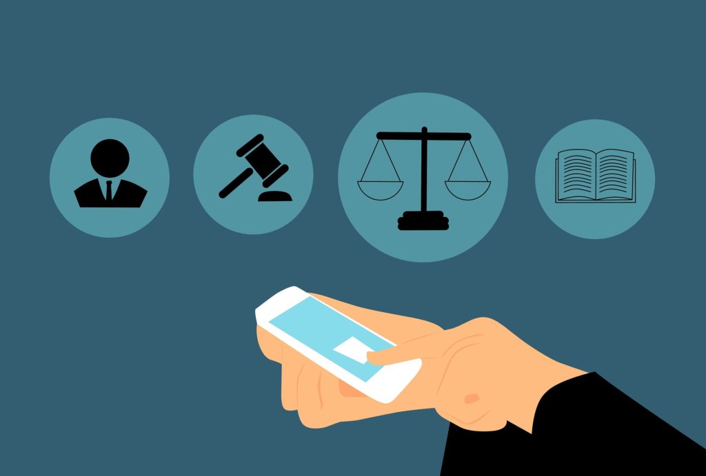 A graphic of a person using a phone infront of various legal icons