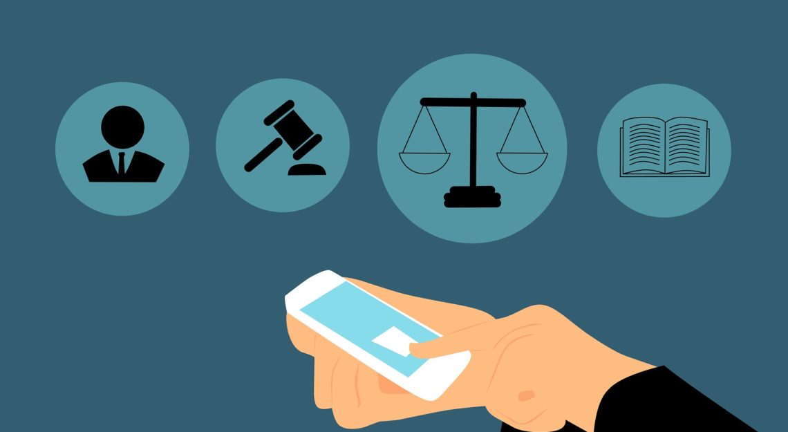 A graphic of a person using a phone infront of various legal icons