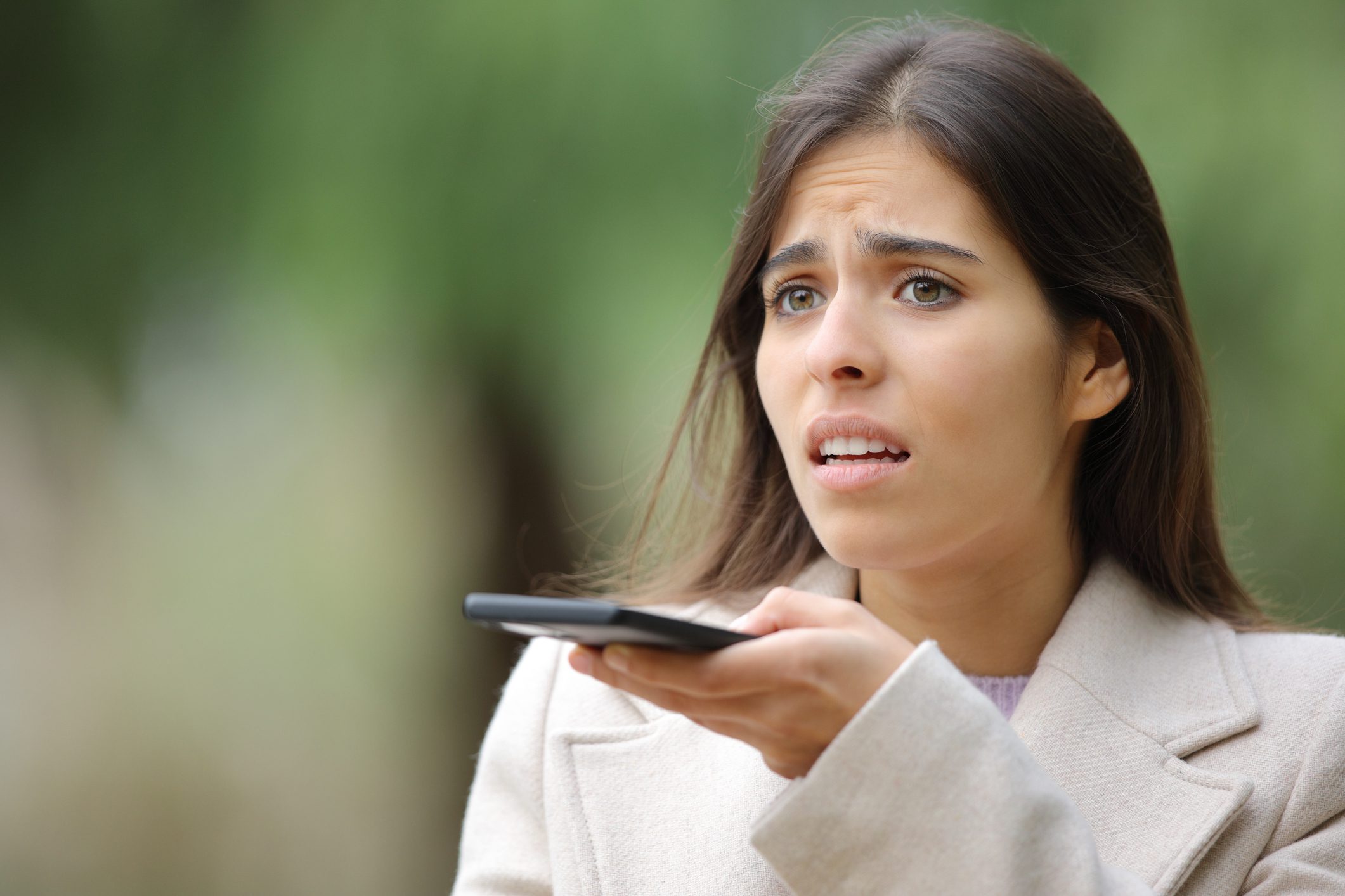 A distressed woman looking for a lawyer with voice search