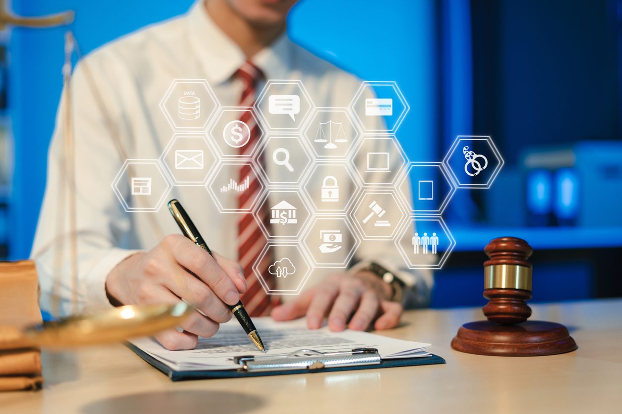 Attorney reviewing legal documents with gavel and digital screens displaying legal marketing analytics - content marketing for law firms