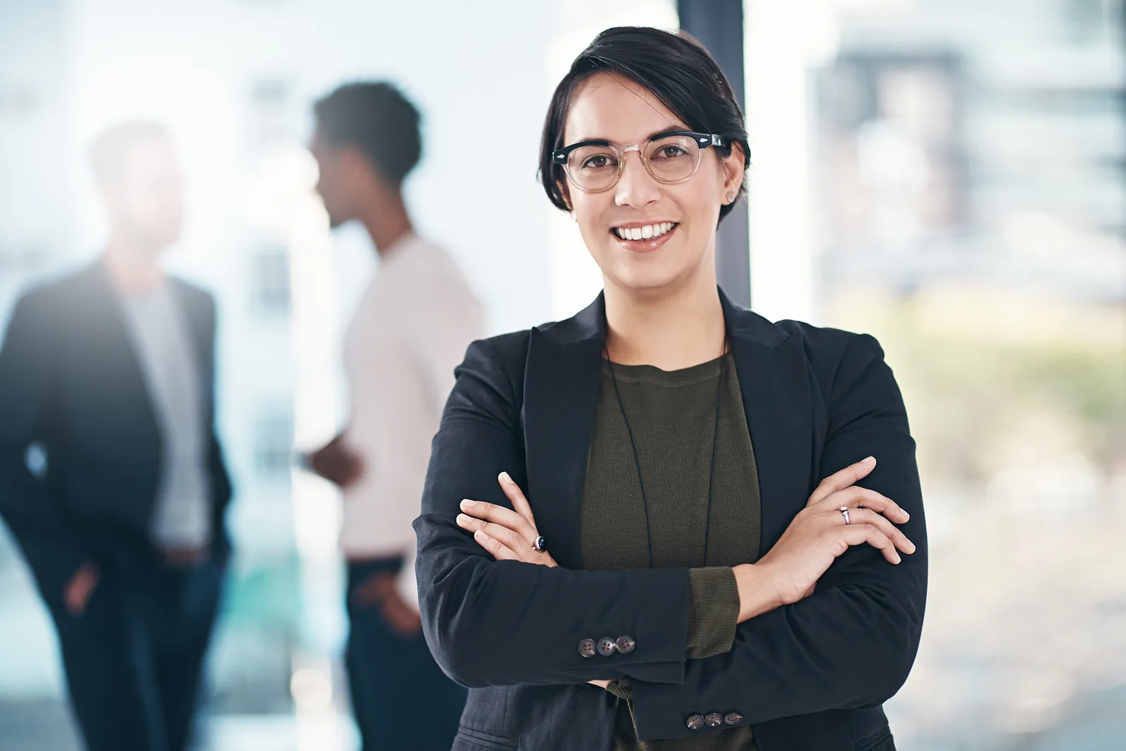 Confident personal injury lawyer marketing professional in a modern law firm office