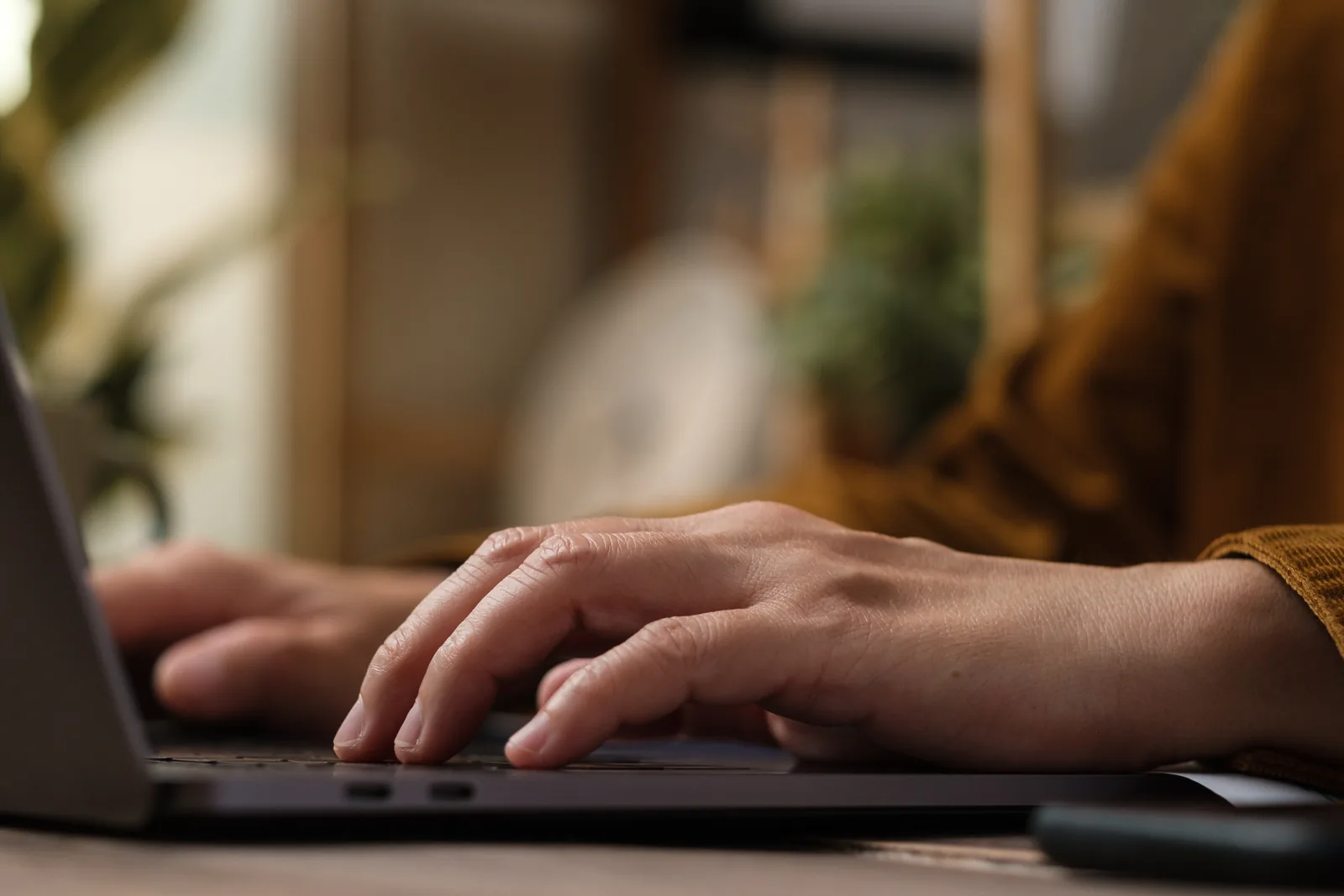 Person working at a laptop reviewing law firm website pages
