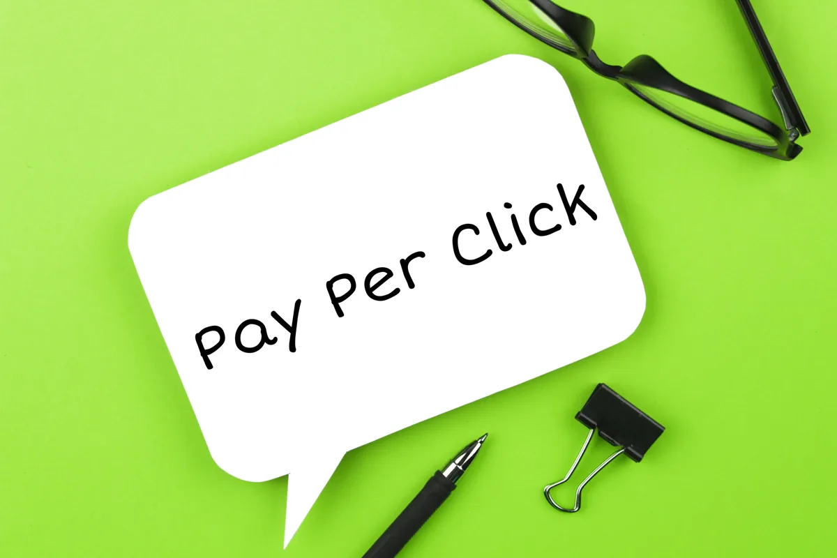 Pay Per Click written on a speech bubble on a green background