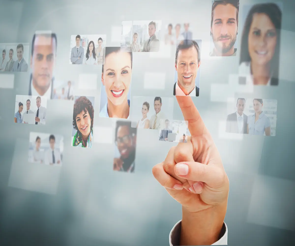 Hand selecting a professional profile from a grid of photos, representing the Lexicon law firm referral program