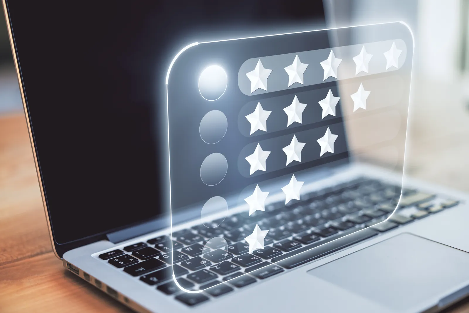 Laptop with a glowing five-star rating panel above the keyboard